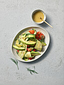 Vegetable salad with avocado, zucchini, and tomatoes