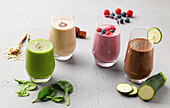 Smoothies with spinach, dates, berries, and chocolate