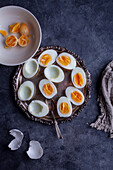 Boiled eggs being prepared for deviled eggs