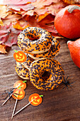 Chocolate donuts with orange frosting for halloween