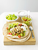Chicken wraps with avocado cream and tomatoes