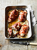 Chicken breast wrapped in prosciutto stuffed with goat cheese and tarragon