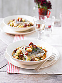 Fried hake with white beans and chorizo broth