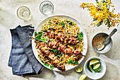 Sticky ginger-honey chicken skewers with noodle salad