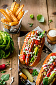 Homemade hot dog served with fries and garlic sauce