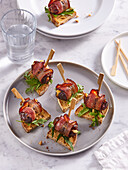Bacon wrapped dates with goat cheese and pecans