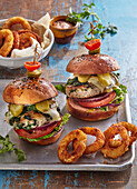 Chicken cheeseburger with fried onion rings