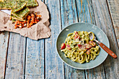 Tagliatelle with herb cream sauce and tomatoes
