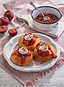 Sweet scones with rum plums and cream
