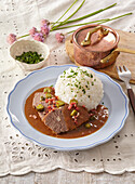 Roast beef with znojmos sauce (Czech cucumber sauce) served with rice