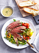 Grilled flank steak with salad