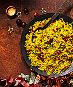 Spicy carrot pilaf with pomegranate seeds for Christmas
