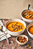 Pumpkin soup with hearty muesli as a topping