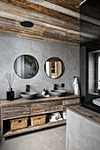 Recycled wood washbasin with two counter tops in the bathroom with grey walls