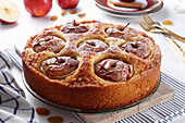 Cake baked with whole apples stuffed with nuts and dried fruits