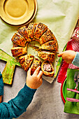 Puff pastry wreath with sausage filling