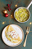 Christmas crepe with ricotta, leek and cheese sauce