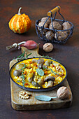 Risotto with pumpkin, mushrooms, fontina cheese and walnuts