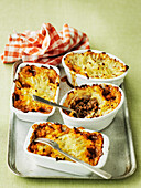 Several Shepherds Pies on an oven tray