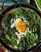 Turkish eggs with spinach and onions