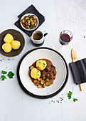 Vegan 'duck' fillets with baked Brussels sprouts and dumplings