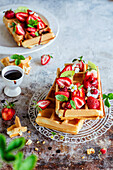 Waffles with strawberries and date syrup