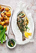 Grilled gilthead with wild garlic pesto and roasted potatoes