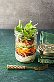 A vegetarian layered salad in a jar