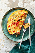 A breakfast omelette with peppers, mushrooms and cottage ham