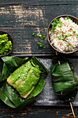 Catfish fillet wrapped in banana leaves served with rice