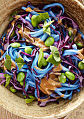 Vegan rice noodle salad with edamame (close-up)