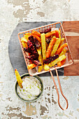 Colourful vegetable fries with vegan lime mayo