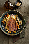 Roasted duck breast with almond polenta and juniper quince