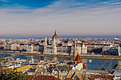 Panoramic day view of neo-Gothic style Orszaghaz Parliament complex landmark on the bank of River Danube, UNESCO World Heritage Site, Budapest, Hungary, Europe