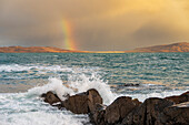 Coastal view with rainbow with crashing waves, Isle of Lewis and Harris, Outer Hebrides, Scotland, United Kingdom, Europe