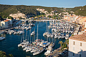 High angle view over the busy harbour from citadel, sunset, Bonifacio, Corse-du-Sud, Corsica, France, Mediterranean, Europe