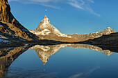Lake Riffelsee with Matterhorn, 4478m, at sunrise, Zermatt, Valais, Swiss Alps, Switzerland, Europe