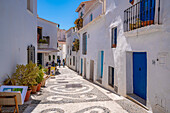 View of cafe in narrow street of whitewashed houses, Frigiliana, Malaga Province, Andalucia, Spain, Mediterranean, Europe