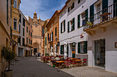 View of cafe in street and cathedral in background, Ciutadella, Menorca, Balearic Islands, Spain, Mediterranean, Europe