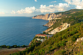 High angle view of Kipoureon monastery surrounded by trees on top of rocks overhanging the sea, Kefalonia, Ionian Islands, Greek Islands, Greece, Europe