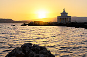 Lighthouse of Saint Theodore on cliffs at sunset, Argostoli, Kefalonia, Ionian Islands, Greek Islands, Greece, Europe