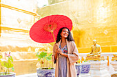 Woman at Wat Phra Singh Woramahawihan, Chiang Mai, Thailand, Southeast Asia, Asia