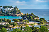 View of hotels overlooking marina and Mediterranean Sea in Cala Galdana, Cala Galdana, Menorca, Balearic Islands, Spain, Mediterranean, Europe