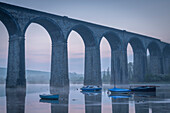 Boats beneath St. Germans Victorian viaduct at dawn, St. Germans in Cornwall, England, United Kingdom, Europe