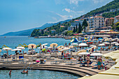 View of restaurants and sunshades on The Lungomare promenade in the town of Opatija, Opatija, Kvarner Bay, Croatia, Europe
