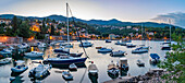 View of boats in the harbour at Ika at dusk, Ika, Kvarner Bay, Eastern Istria, Croatia, Europe