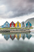 Traditional and colourful cabins on the oceanfront of Leirvik and reflection, Eysturoy island, Faroe Islands, Denmark, Europe