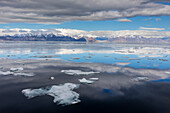 A view of the snow covered mountains surrounding Pond Inlet, Nunavut, Canada, North America