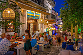 View of restaurant and bars in Skiathos Town at dusk, Skiathos Island, Sporades Islands, Greek Islands, Greece, Europe