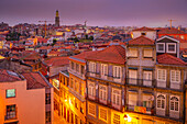 View of buildings and terracota rooftops of The Ribeira district at dusk, UNESCO World Heritage Site, Porto, Norte, Portugal, Europe